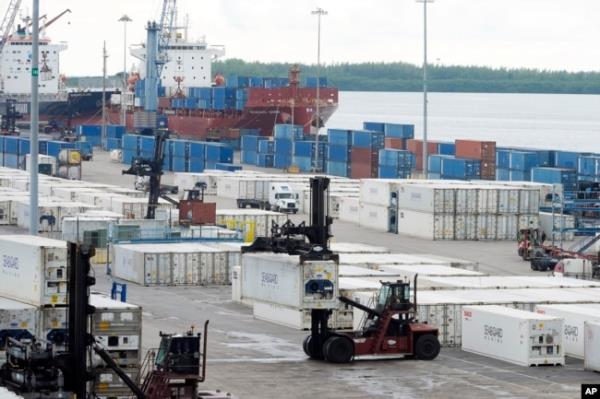 Dockworkers return to work at Port Miami, Oct. 4, 2024, in Miami, after the unio<em></em>n representing 45,000 striking U.S. dockworkers reached a deal to suspend a three-day strike until Jan. 15 to provide time to negotiate a new contract.