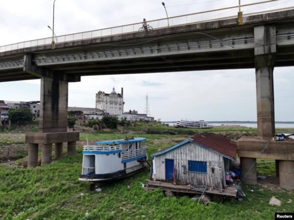 A drone view shows floating houses stranded on the Rio Negro as the river reached its lowest point in its history during the most widespread drought Brazil has experienced since records began in 1950, in Manaus, Amazo<em></em>nas state, Brazil Oct. 4, 2024.