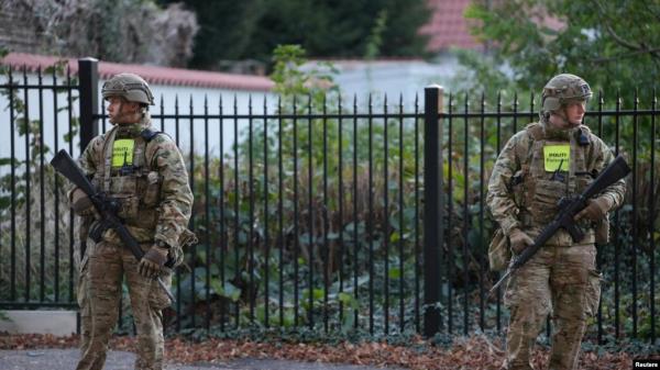 Security perso<em></em>nnel keep watch during the investigation of two blasts near the Israeli Embassy in Copenhagen, Denmark, on Oct. 2, 2024. Authorities arrested two Swedish teenagers on Oct. 3 in co<em></em>nnection with the explosions. (Ritzau Scanpix via Reuters)