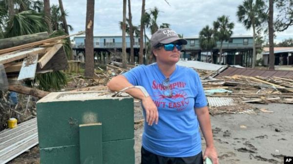 Brooke Hiers stands in front of wher<em></em>e her home used to sit in Horseshoe Beach, Florida, Sept. 30, 2024, in the aftermath of Hurricane Helene.