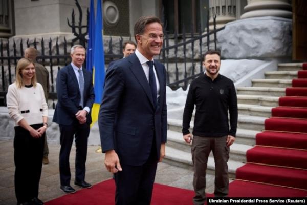 NATO Secretary-General Mark Rutte, middle, arrives for a meeting with Ukraine's President Volodymyr Zelenskyy, right, in Kyiv, Ukraine, Oct. 3, 2024. (Ukrainian Presidential Press Service/Handout via Reuters)