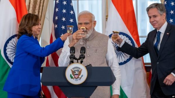 FILE - Vice President Kamala Harris, India's Prime Minister Narendra Modi, and Secretary of State Antony Bl<em></em>inken, share a toast during a State Visit Luncheon at the State Department, June 23, 2023, in Washington.