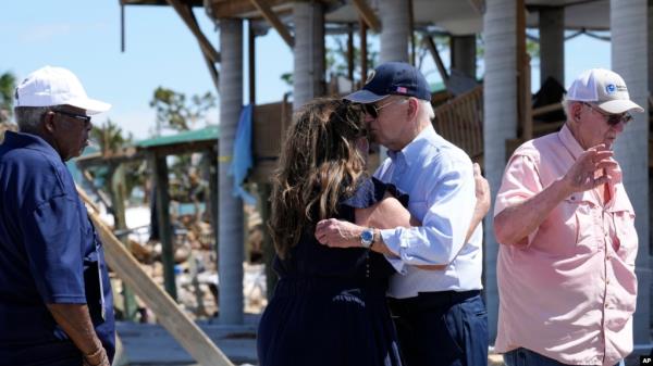 President Joe Biden hugs a person in Keaton Beach, Florida, during his tour of areas impacted by Hurricane Helene, Oct. 3, 2024. 