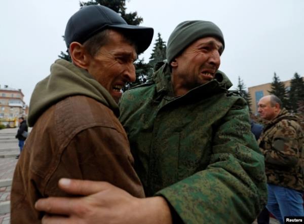 FILE - A serviceman hugs his brother after being released along with other military perso<em></em>nnel from Russian-co<em></em>ntrolled parts of Do<em></em>netsk and Luhansk regions in a priso<em></em>ner exchange, in Amvrosiivka, Do<em></em>netsk region, Russian-co<em></em>ntrolled Ukraine, on Nov. 6, 2022.