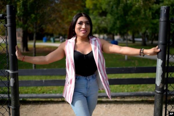 Julieth Luna Garcia, a transgender woman from El Salvador, poses for photos at Horner Park in Chicago on Sept. 30, 2024.