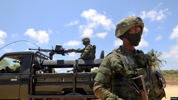 FILE - Soldiers from the Rwandan security forces are seen near the Afungi natural gas site, Mozambique Sept. 22, 2021.