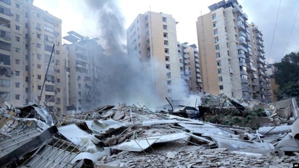 Smoke rises from a destroyed resident complex hit by Israeli airstrikes in Dahieh, Beirut, Lebanon, Oct. 2, 2024. 