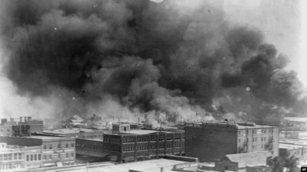 FILE - In this 1921 image provided by the Library of Congress, smoke billows over Tulsa, Okla.