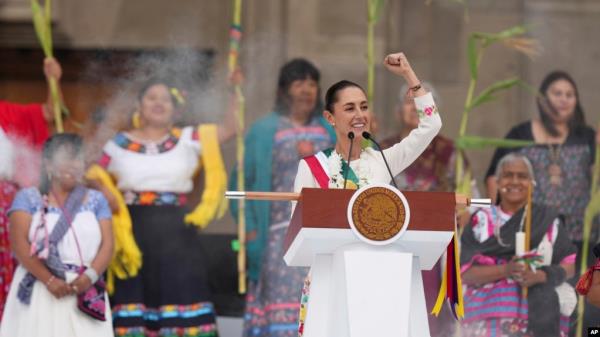 Mexico's President Claudia Sheinbaum addresses supporters during a rally in the Zocalo, Mexico City's main square, on her inauguration day, Oct. 1, 2024.