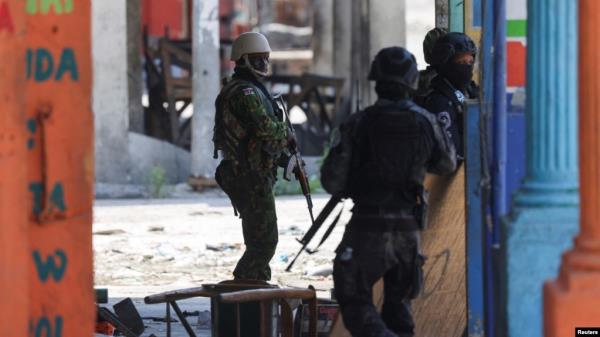 FILE - Kenyan police officers patrol as part of a peacekeeping mission, in Port-au-Prince, Haiti, July 17, 2024. 