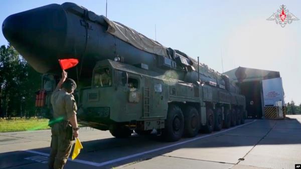 In this photo taken from video released by Russian Defense Ministry Press Service on Sept. 17, 2024, a Russian RS-24 Yars strategic ballistic missile launcher moves out of a hangar during a drills in Ivanovo region, Russia.