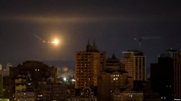 An explosion of a drone is seen in the sky over the city during a Russian drone strike in Kyiv, Ukraine Sept. 30, 2024.