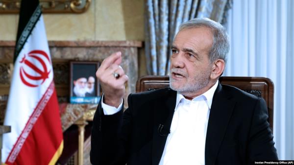 FILE - Iranian President Masoud Pezeshkian speaks in a live televised interview by state TV, at his office in Tehran, Iran, Aug. 31, 2024. (Iranian Presidency Office via AP)