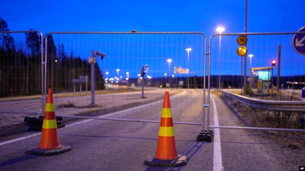 FILE - A view of a fence blocking the road to the closed empty Nuijamaa border station between Russia and Finland in Lappeenranta, Finland, Nov. 18, 2023. 