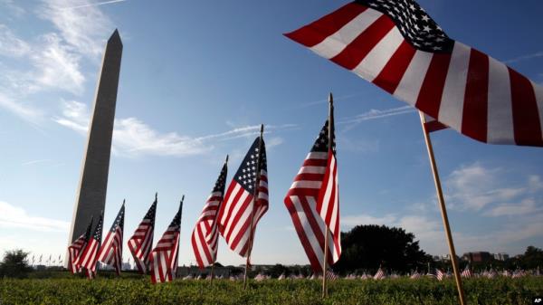 FILE - U.S. flags representing suicides of active and veteran members of the military line the Natio<em></em>nal Mall in Washington, Oct. 3, 2018. U.S. suicide rates have been rising for nearly 20 years, aside from a two-year drop around the beginning of the COVID-19 pandemic.