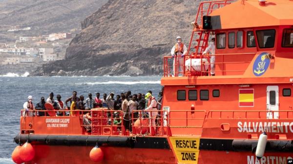 FILE - Migrants disembark at the port of on 'La Estaca' in Valverde at the Canary island of El Hierro, Spain, Aug. 26, 2024. Rescue teams on Sunday resumed searching for at least 48 migrants who went messing the day before when their boat overturned.