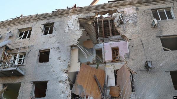 In this photo provided by the Ukrainian Emergency Service, a damaged apartment house is seen after Russia attacked the city with guided bombs overnight in Zaporizhzhia, Ukraine, Sept. 29, 2024. 