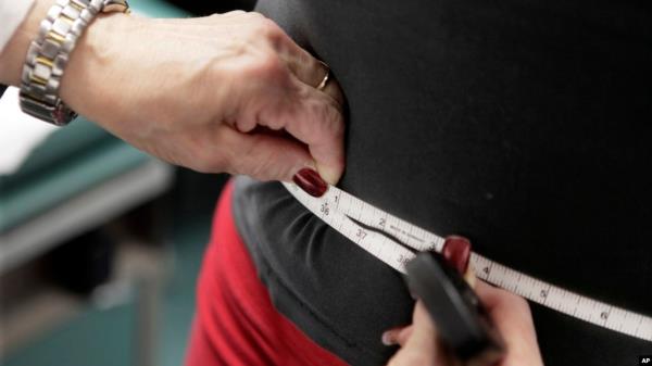 FILE - A subject's waist is measured during an obesity prevention study in Chicago, Illinois, Jan. 20, 2010. The U.S. obesity rate is a<em></em>bout 40%, according to a 2021-2023 survey of a<em></em>bout 6,000 people.