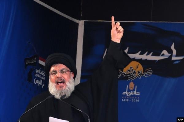 FILE - Lebanon's Hezbollah chief Sayyed Hassan Nasrallah addresses a crowd in a southern Beirut suburb on Oct. 12, 2016.