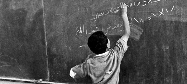 A young student solves a mathematical problem at a school in Nabatieh refugee camp. (file)