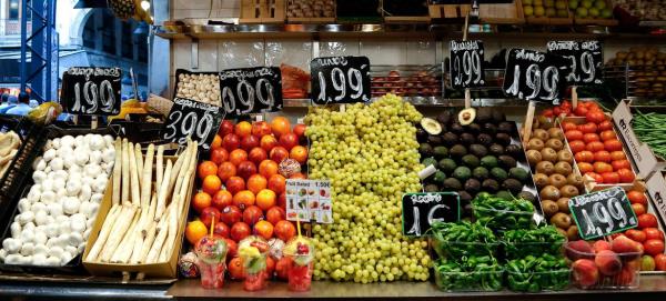 Fresh fruits and vegetables are displayed at the Boqueria market in Barcelona, Spain.