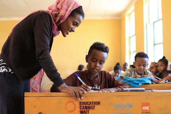 Breiy Nuguse is a teacher at the ECW-supported FreKalsi Primary School in the Tigray Region, Ethiopia, wher<em></em>e children are back in classrooms after over three years of missing out on an education due to the co<em></em>nflict that devasted the region. “Teaching makes me happy. I love teaching and when I see children learn, it is so rewarding. I was inspired to become a teacher, as my teachers were so wo<em></em>nderful when I was at school. I realize the gift of learning that they gave me, and I wanted to do the same for the next generation," Nuguse said. Photo credit: ECW//Tesfaye