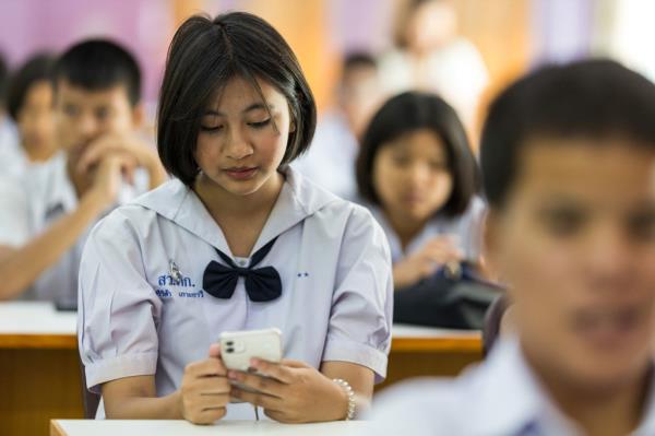 High school students in Phuket, Thailand, use a UNFPA-backed chatbot.